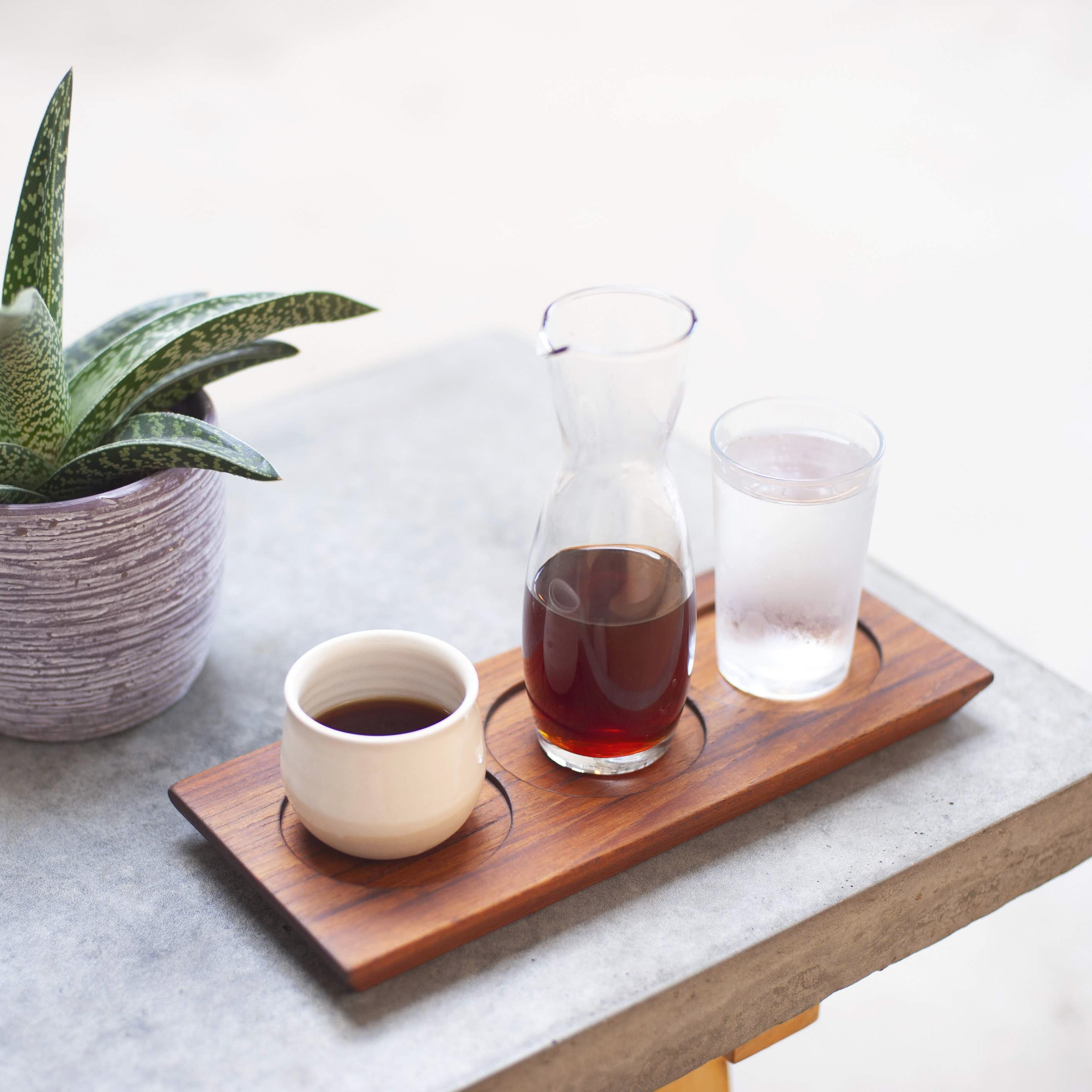 Coffee and ceramic on table.